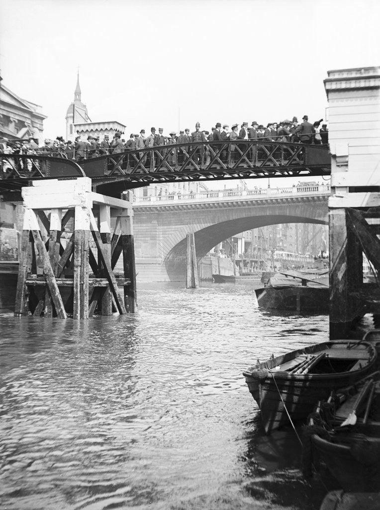 Detail of Passengers for the river bus service on the footbridge to London Bridge Pier, London by Anonymous