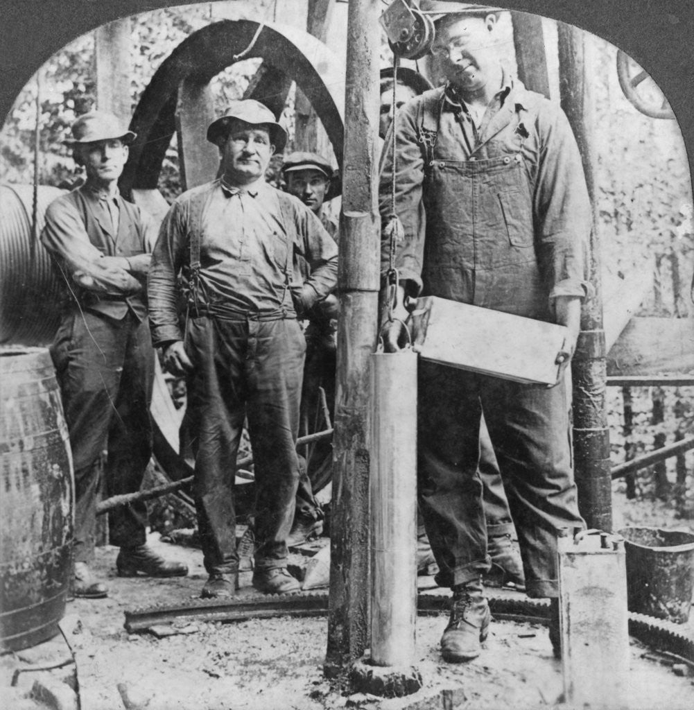 Detail of Filling a shell with nitro-glycerine, oil field in Pennsylvania, USA by Keystone View Company