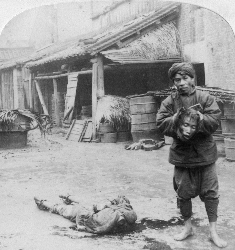 Detail of The grim executioner taking the labled head to exhibit a warning by Underwood & Underwood