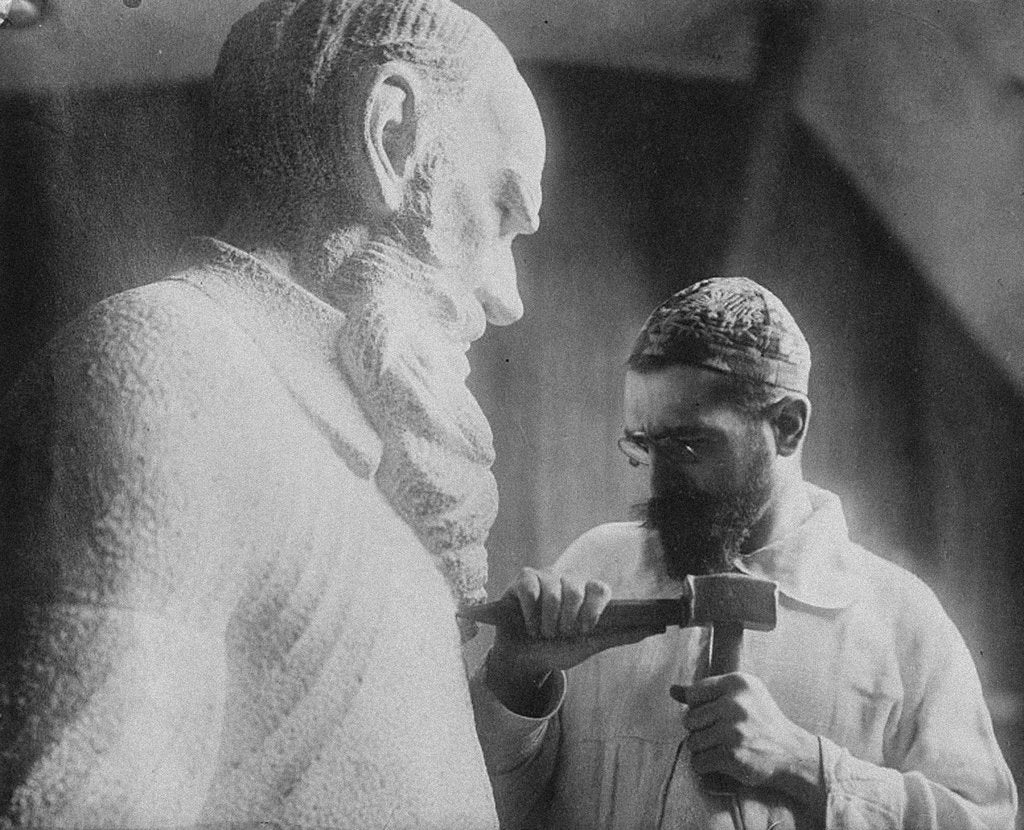 Detail of Russian sculptor Sergey Merkurov working on his statue of Leo Tolstoy by Anonymous