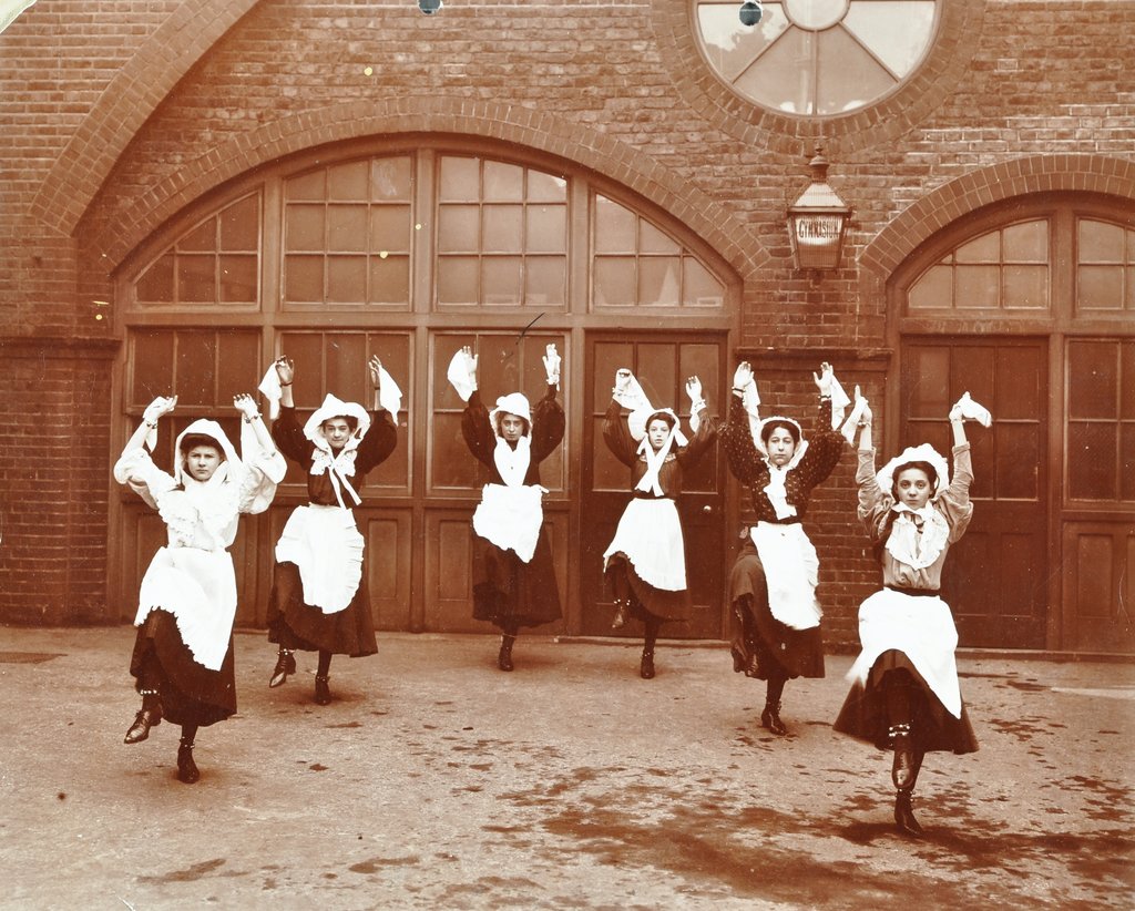 Detail of Girls morris dancing in playground, Thomas Street Girls School, Limehouse, Stepney, London, 1908 by Unknown