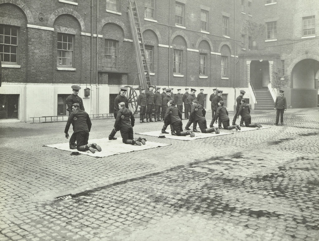 Detail of Demonstrating how to pick up an unconscious person, London Fire Brigade Headquarters, London, 1910 by Unknown