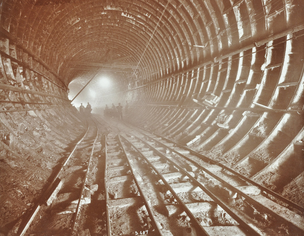 Detail of Men pushing railway trucks along the Rotherhithe Tunnel, Stepney, London, June 1907 by Unknown