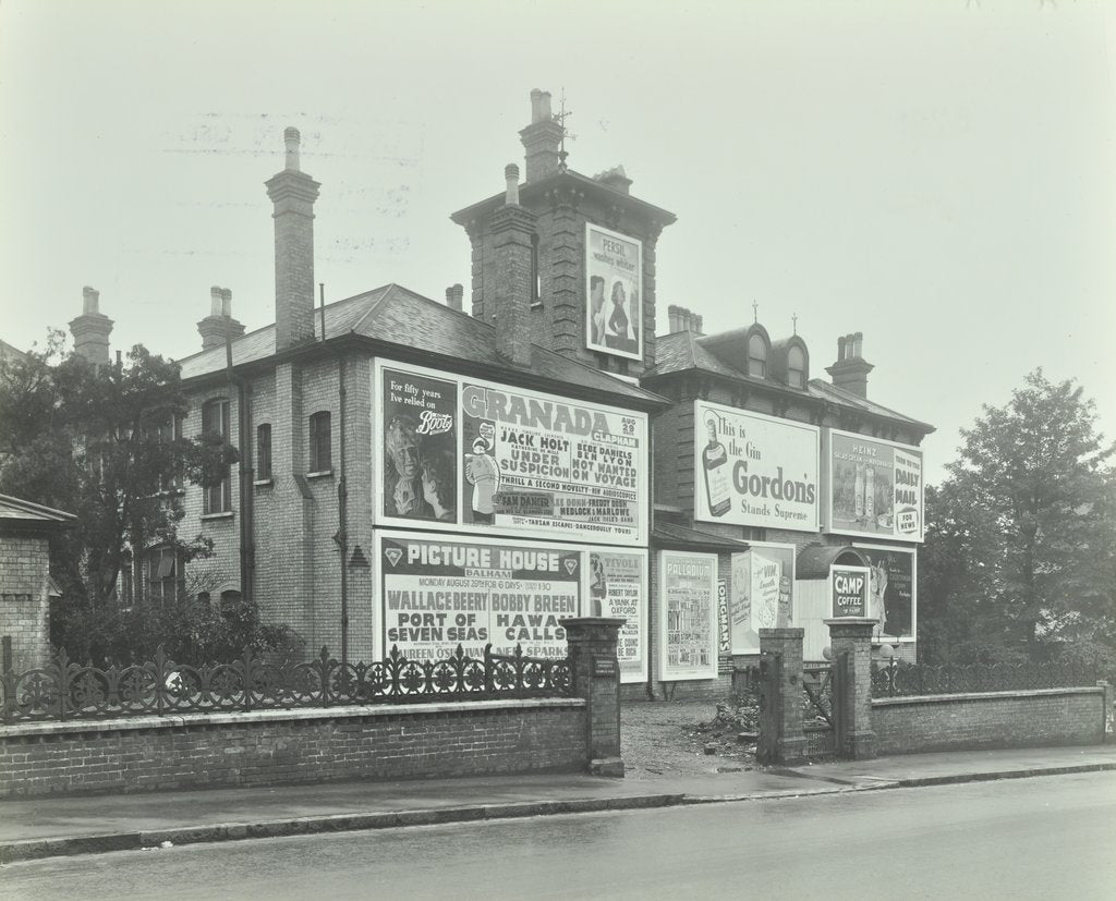 Detail of Advertising hoardings on the wall of a building, Wandsworth, London, 1938 by Unknown