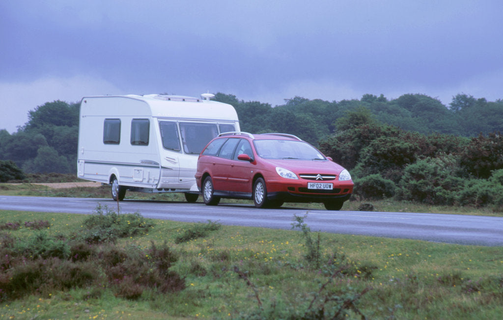 Detail of 2002 Citroen C5 hdi towing a caravan by Unknown