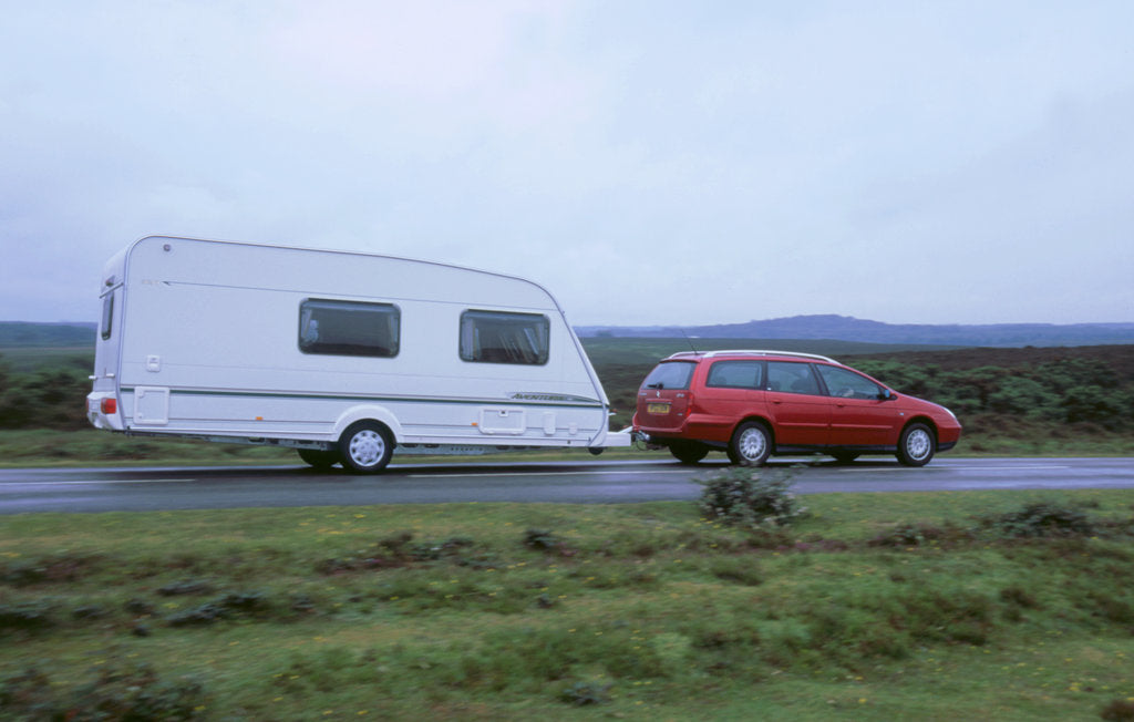 Detail of 2002 Citroen C5 hdi towing a caravan by Unknown