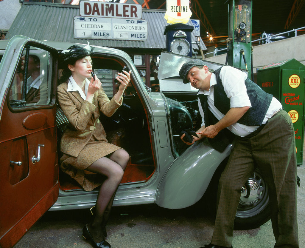 Detail of Mechanic with lady driver doing her make up, 1930's Hillman Minx by Unknown