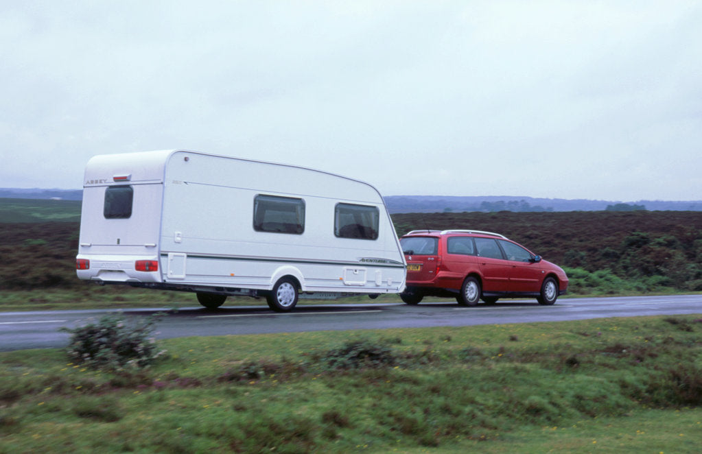 Detail of 2002 Citroen C5 towing a caravan by Unknown