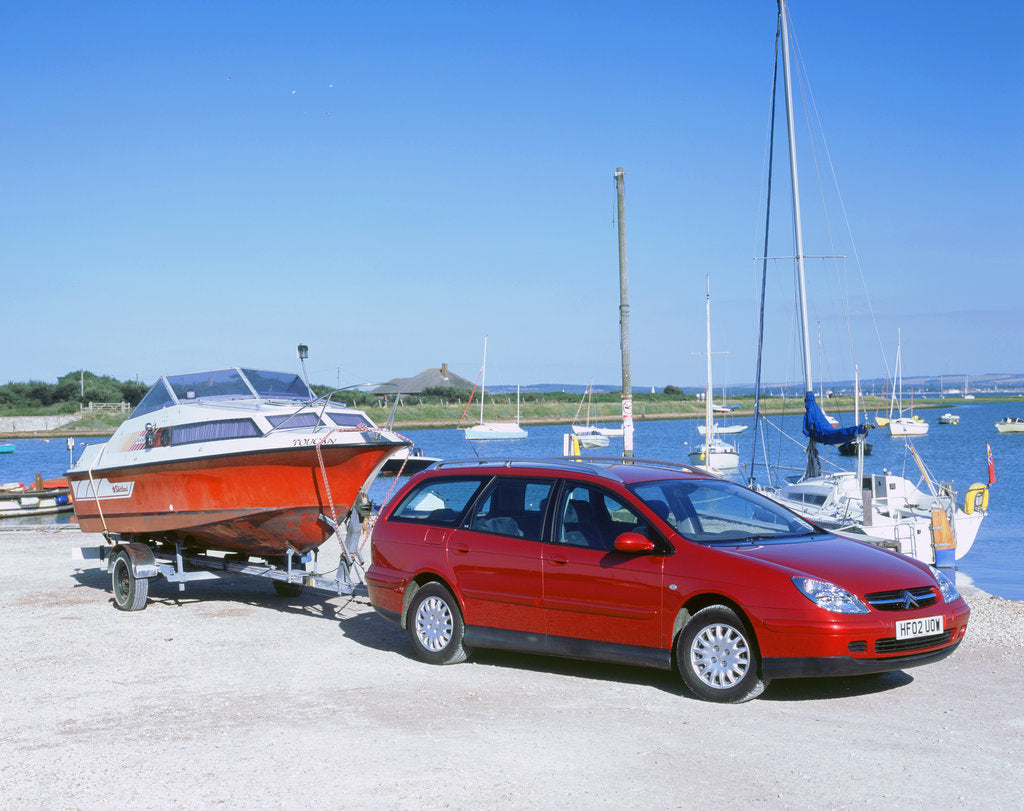 Detail of 2002 Citroen C5 hdi towing a boat by harbour by Unknown