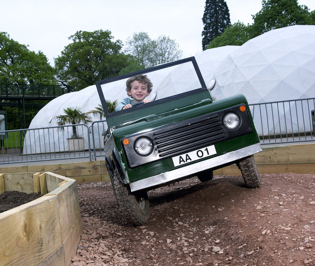 Detail of Child driving a toy Land Rover by Unknown