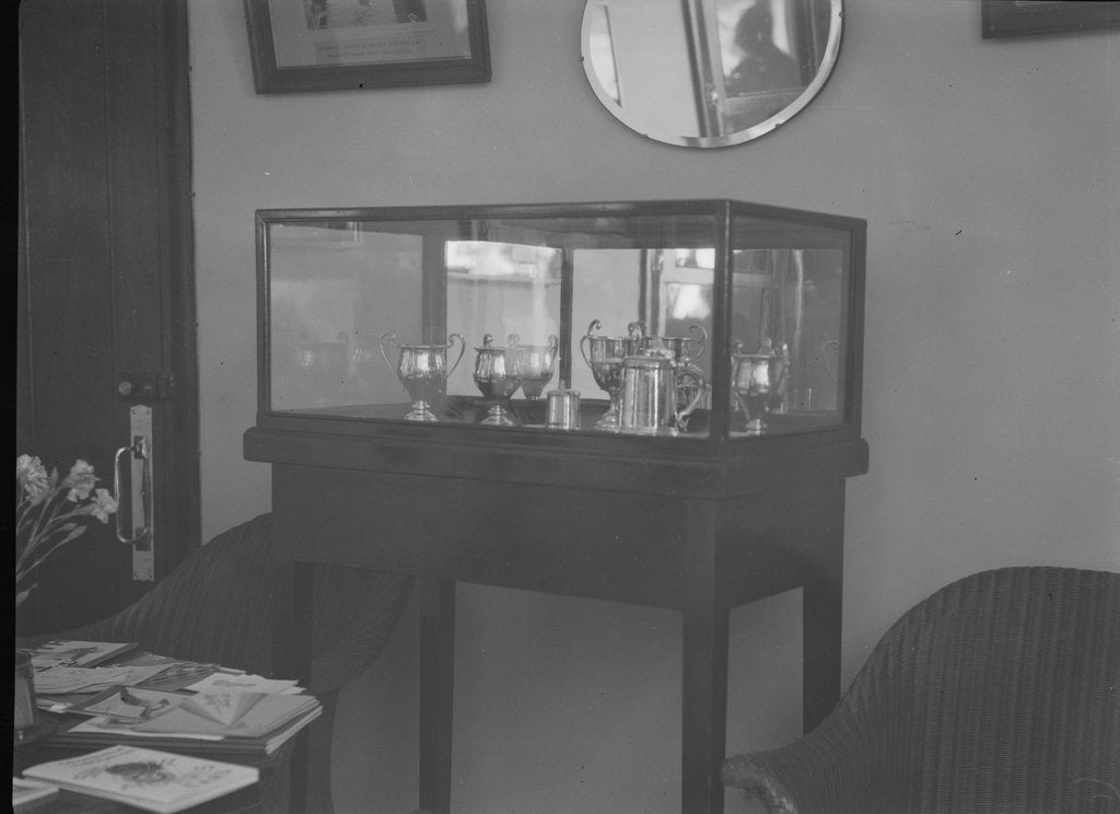 Detail of Cabinet containing motor racing trophies by Bill Brunell