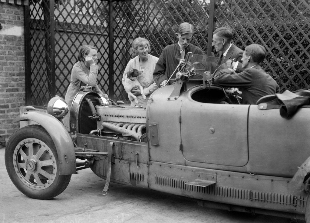 Detail of Denis Evans inspecting the plugs of his Bugatti Type 43 2262cc by Bill Brunell