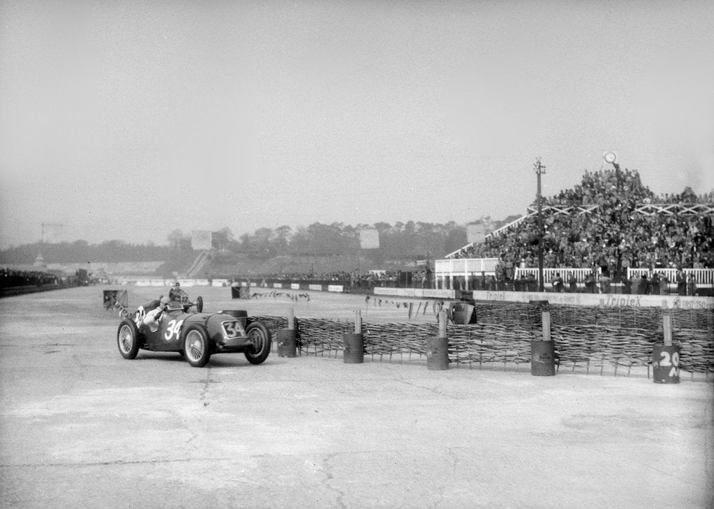 Detail of Riley 1985 cc negotiating the chicane at the JCC International Trophy, Brooklands, 2 May 1936 by Bill Brunell
