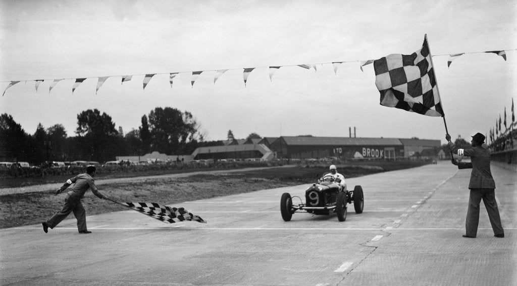 Detail of Alfa Romeo taking the chequred flag in a race at Brooklands by Bill Brunell