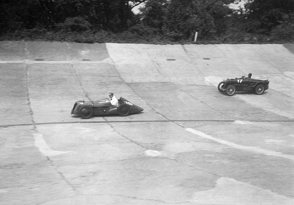 Detail of Austin 747 cc with sreamlined racing body leading an MG C type on the Members Banking at Brooklands by Bill Brunell