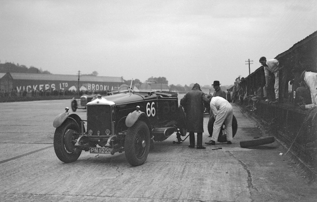 Detail of GL Baker's 5954 cc Minerva undergoing a rear wheel change at Brooklands by Bill Brunell