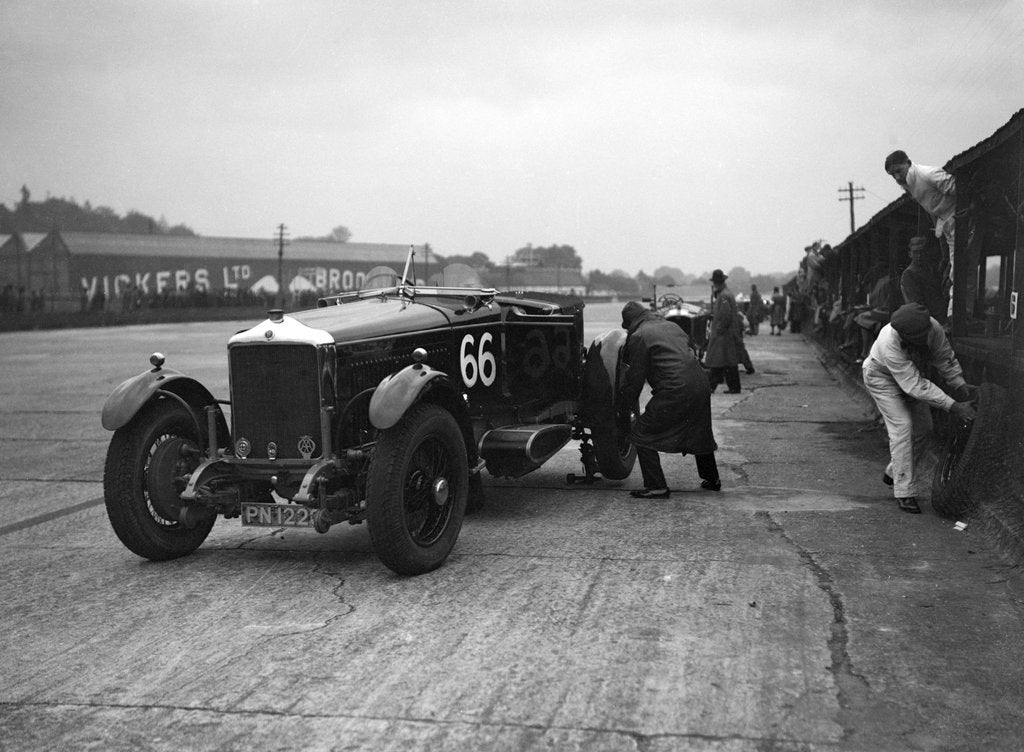 Detail of GL Baker's 5954 cc Minerva undergoing a rear wheel change at Brooklands by Bill Brunell