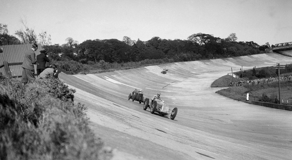 Detail of Earl Howe's Delage GP leading ER Hall's Bentley at the BARC Meeting, Brooklands, 25 May 1931 by Bill Brunell