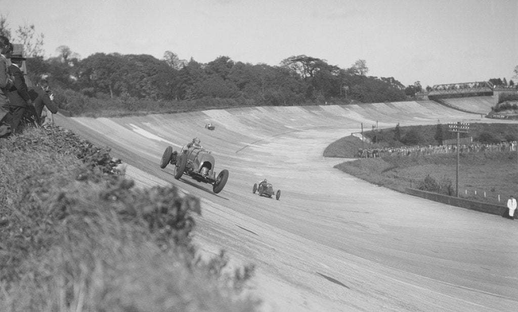 Detail of Sir Henry Birkin's Bentley leading Earl Howe's Bugatti Type 54, BARC meeting, Brooklands, May 1932 by Bill Brunell