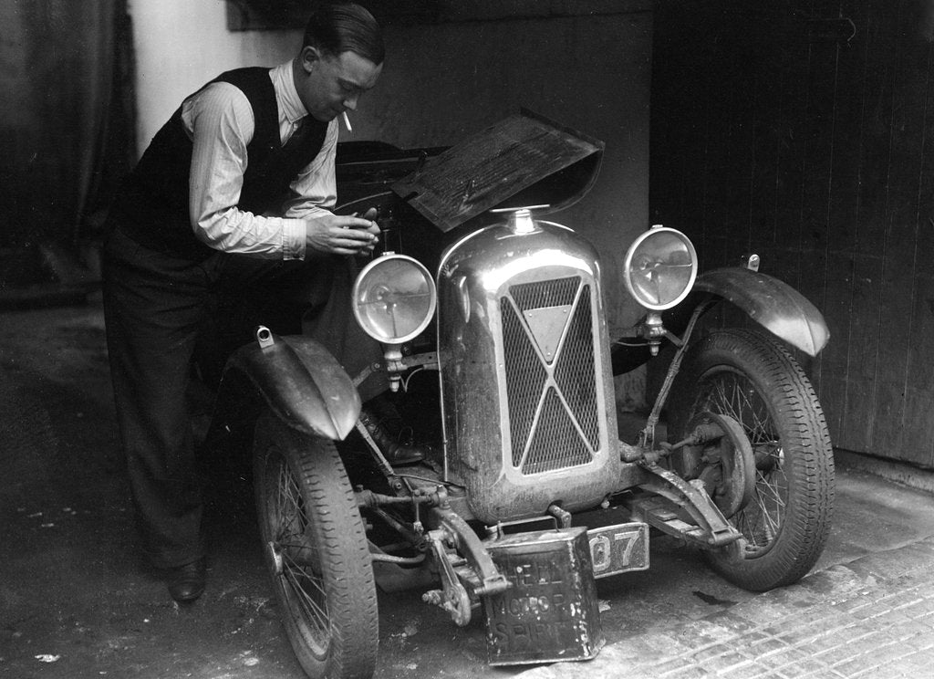 Detail of Geoffrey Baker working on a Salmson 1090cc car by Bill Brunell