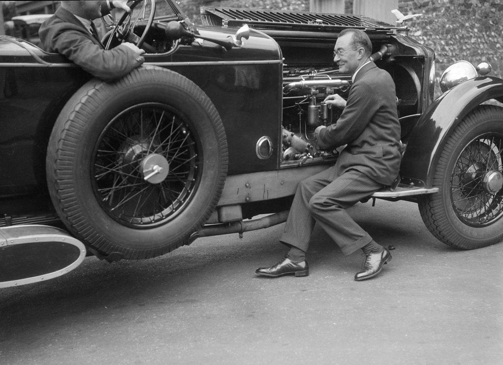 Detail of Geoffrey Baker inspecting the engine of a Minerva car by Bill Brunell