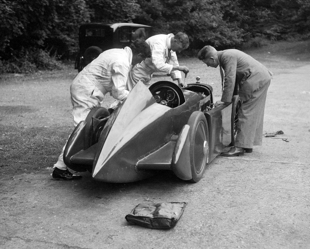 Detail of Mechanics working on Leon Cushman's Austin 7 racer for a speed record attempt, Brooklands, 1931 by Bill Brunell