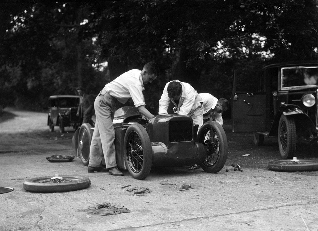 Detail of Mechanics working on Leon Cushman's Austin 7 racer for a speed record attempt, Brooklands, 1931 by Bill Brunell