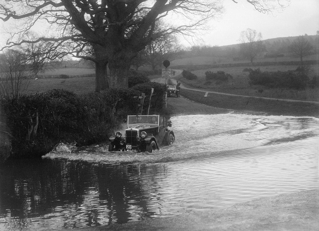 Detail of 1932 Morris Minor tourer driving through a ford during a motoring trial, 1936 by Bill Brunell