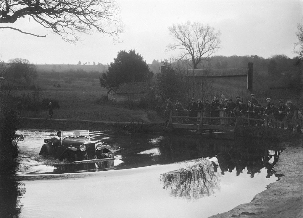 Detail of Hillman Aero Minx open 2-seater driving through a ford during a motoring trial, 1936 by Bill Brunell