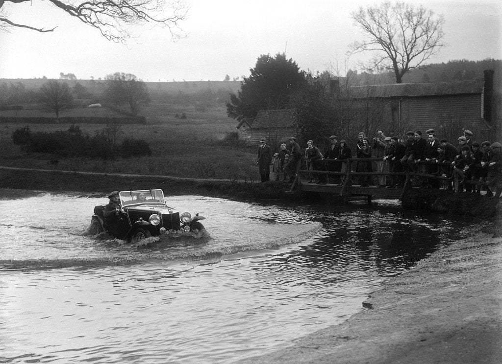 Detail of MG Magnette driving through a ford during a motoring trial, 1936 by Bill Brunell