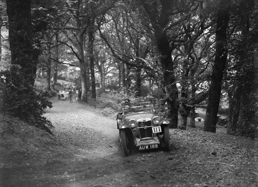 Detail of MG Magna competing in the B&HMC Brighton-Beer Trial, Fingle Bridge Hill, Devon, 1934 by Bill Brunell