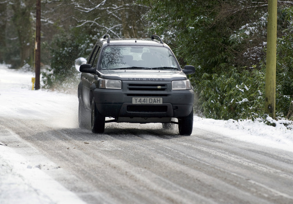 Detail of 2001 Land Rover Freelander driving on icy road by Unknown