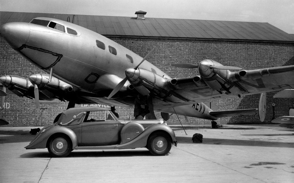 Detail of 1938 Lagonda V12 4.5 litre drophead coupe with D.H. Albatross aeroplane by Unknown