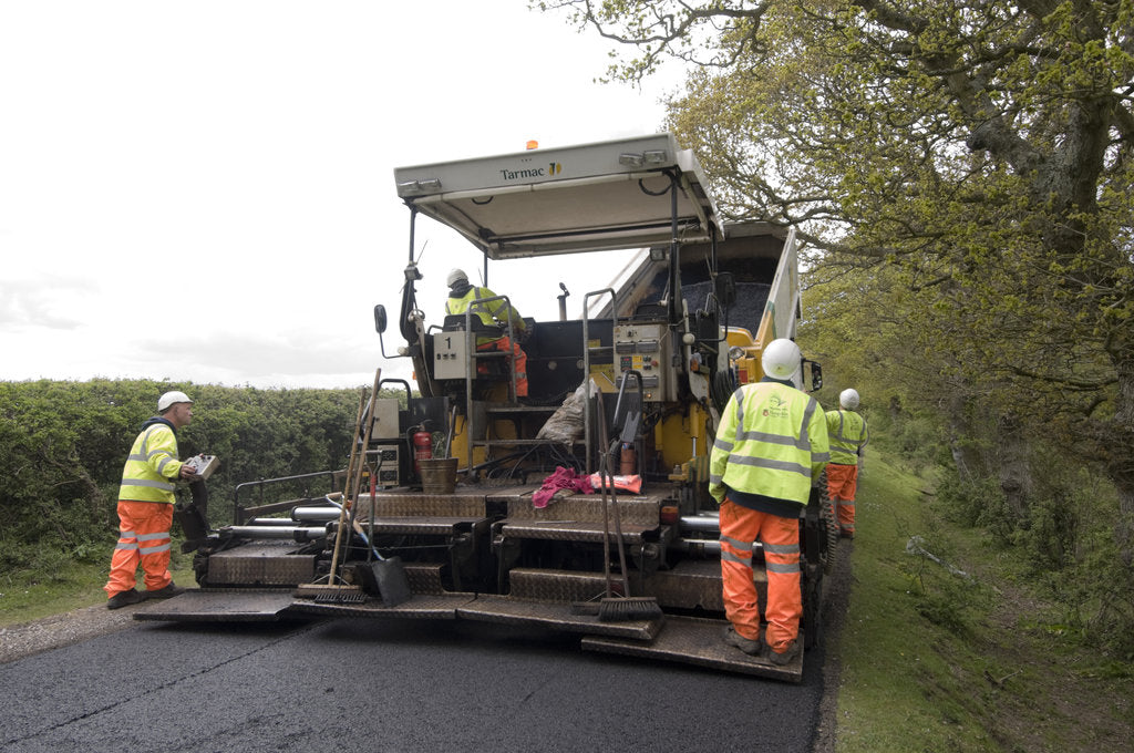 Detail of Road resurfacing work repairing potholes by Unknown