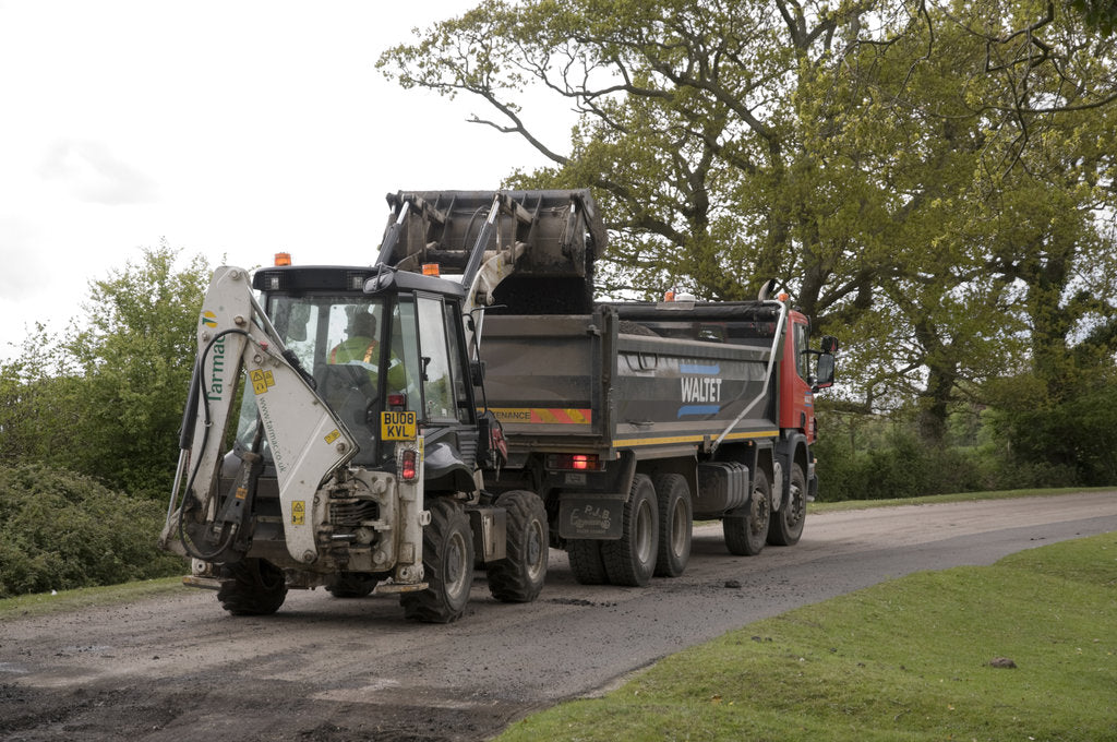 Detail of Road resurfacing work repairing potholes by Unknown