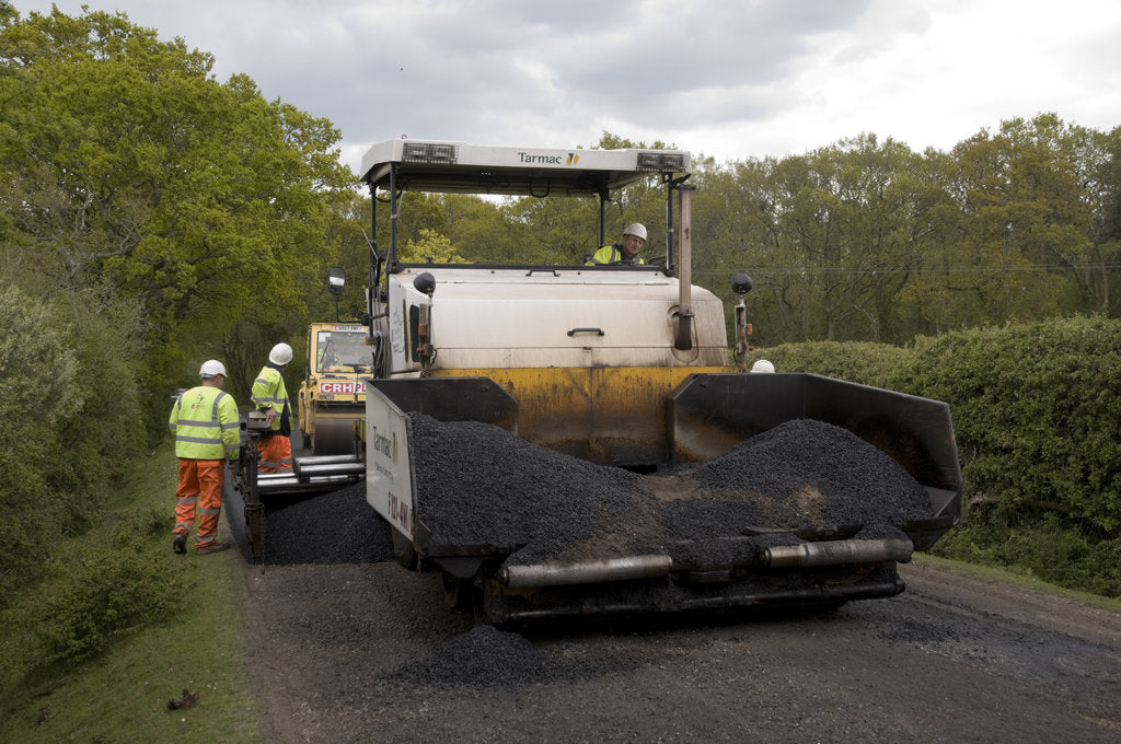 Detail of Road resurfacing work repairing potholes by Unknown