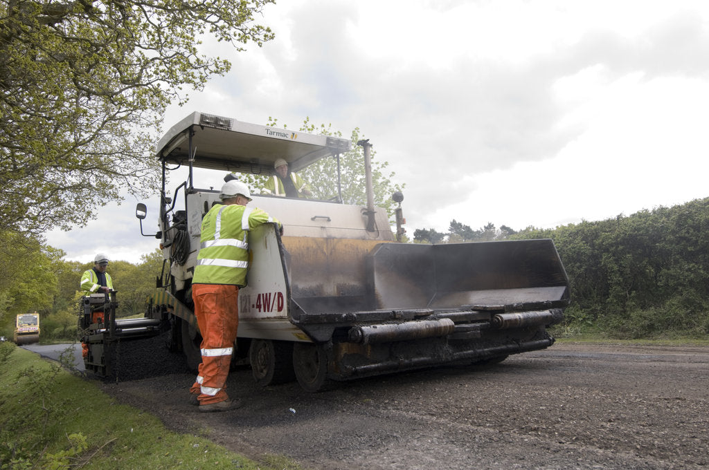 Detail of Road resurfacing work repairing potholes by Unknown