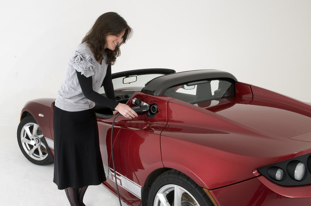 Detail of 2010 Tesla Roadster electric car being re charged by Unknown