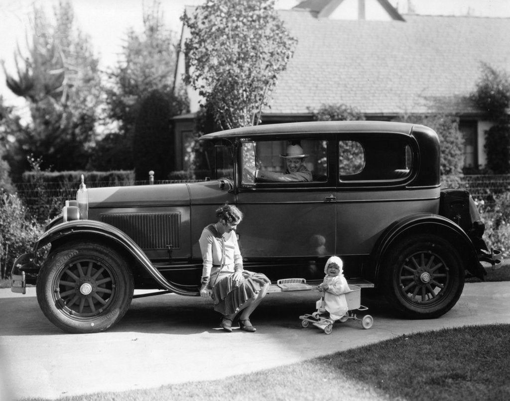 Detail of Stan Laurel at the wheel of 1927 Hupmobile with his wife Lois and daughter Lois by Unknown