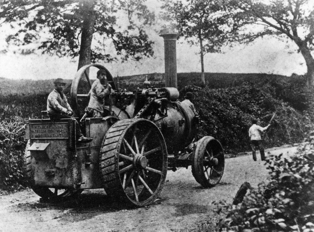 Detail of 1869 Tasker traction engine with red flag man at the front by Anonymous