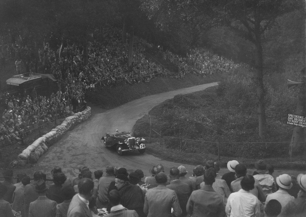 Detail of Unidentified open 4-seater car competing in the Shelsley Walsh Hillclimb, Worcestershire, 1935 by Bill Brunell