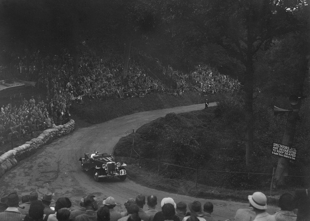 Detail of Unidentified open 4-seater car competing in the Shelsley Walsh Hillclimb, Worcestershire, 1935 by Bill Brunell