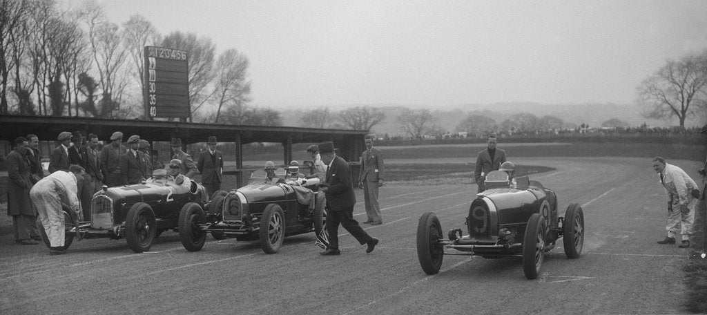 Detail of Alfa Romeo and two Bugatti Type 35s on the start line, Donington Park, Leicestershire, 1935 by Bill Brunell