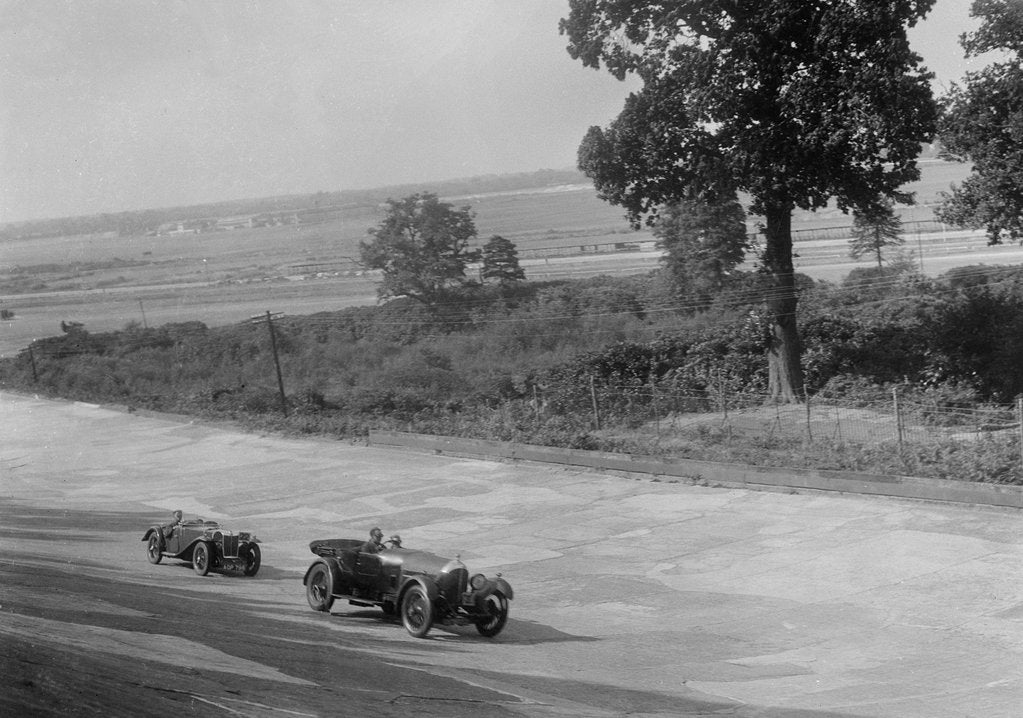 Detail of Bentley of FE Elgood and MG Magna of MB Watson racing at a MCC meeting, Brooklands, Surrey, 1933 by Bill Brunell
