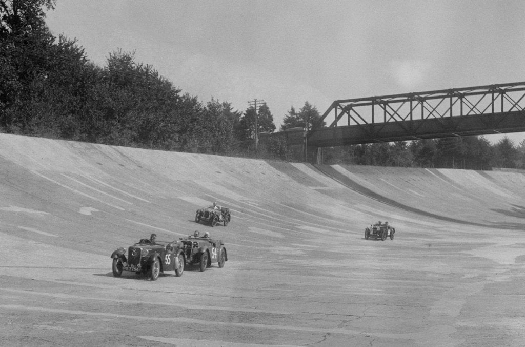 Detail of Singers of TW Fassett and Alf Langley and an MG racing at a MCC meeting, Brooklands, Surrey, 1933 by Bill Brunell
