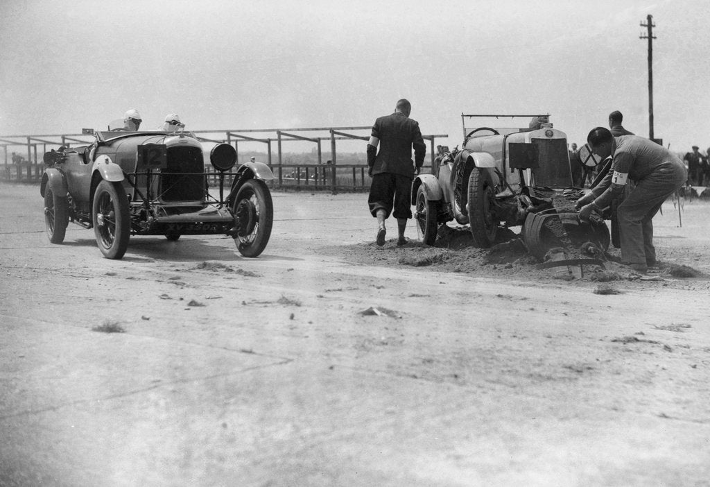 Detail of RSS Hebeler's Lagonda passing R Childe's crashed Lea-Francis, BARC 6-Hour Race, Brooklands, 1929, by Bill Brunell