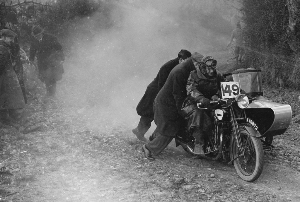 Detail of Motorcycle and sidecar receiving a push during a trial, c1930s by Bill Brunell