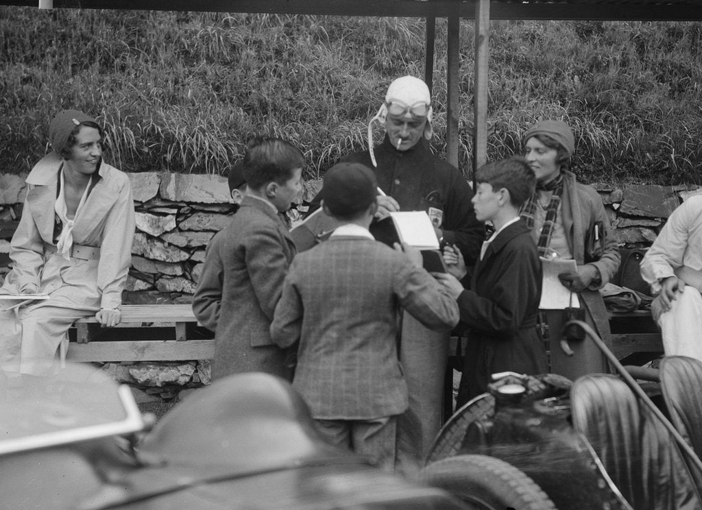 Detail of Goldie Gardner signing autographs at the Irish Grand Prix, Phoenix Park, Dublin, 1930 by Bill Brunell