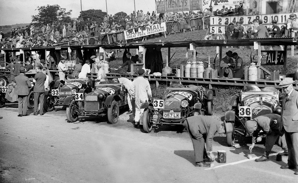 Detail of Alfa Romeos in the pits at the RAC TT Race, Ards Circuit, Belfast, 1929 by Bill Brunell