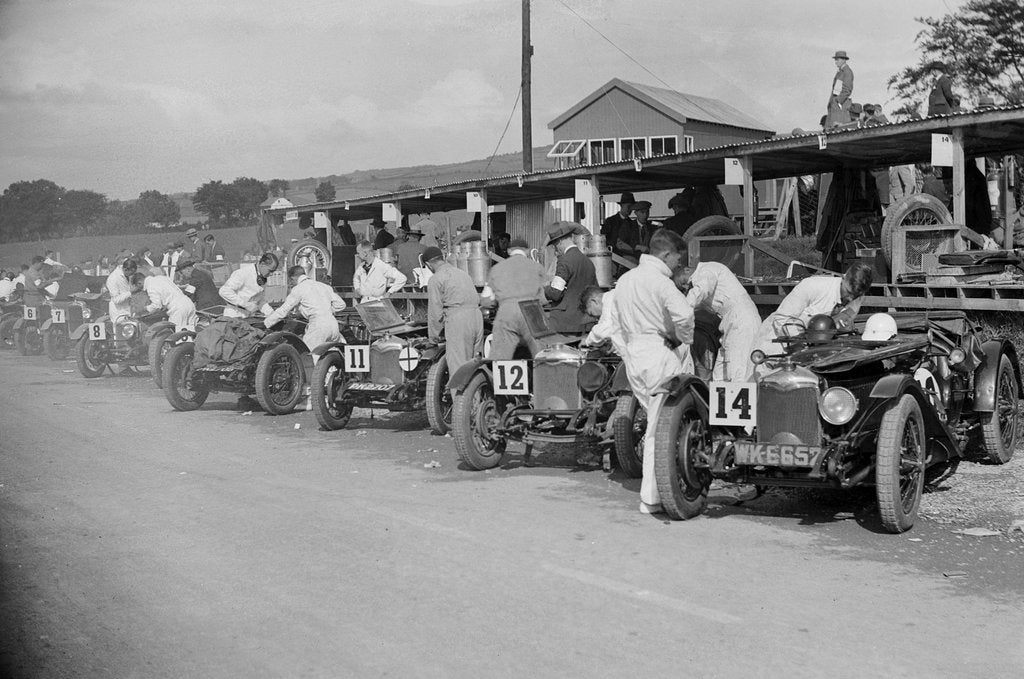 Detail of Triumph and Riley cars in the pits at the RAC TT Race, Ards Circuit, Belfast, 1929 by Bill Brunell